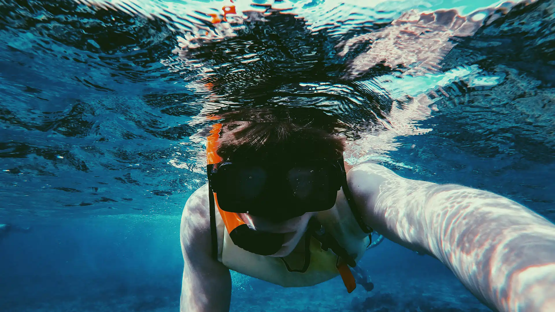 Scuba diver capturing underwater selfie at Netrani Island with Dolphin Dive Murudeshwar Title: Underwater Exploration – Dolphin Dive Murudeshwar